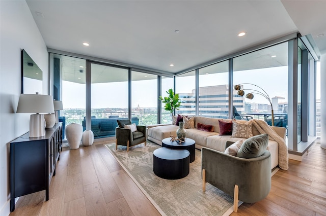 3130 N Harwood St Unit 1404, Dallas, TX 75201 - living area featuring expansive windows, light wood finished floors, and recessed lighting