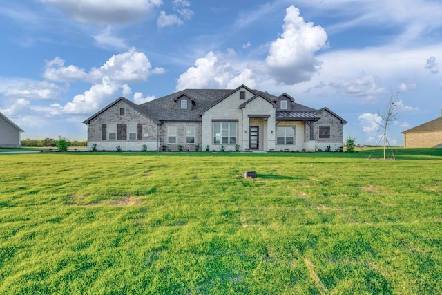 french provincial home featuring a front yard