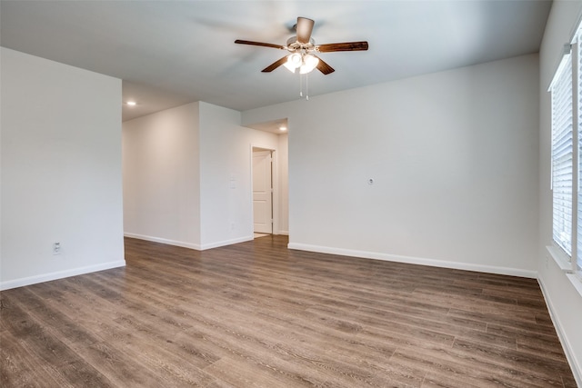 spare room with recessed lighting, baseboards, wood finished floors, and ceiling fan