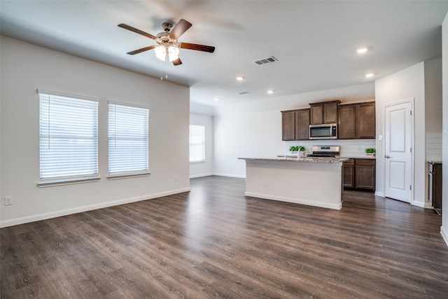 kitchen featuring visible vents, appliances with stainless steel finishes, a ceiling fan, and dark wood-style flooring