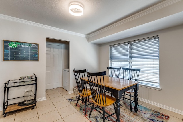 5805 Trail Crest Dr, Arlington, TX 76017 - dining space featuring crown molding, washer / dryer, and light tile patterned flooring