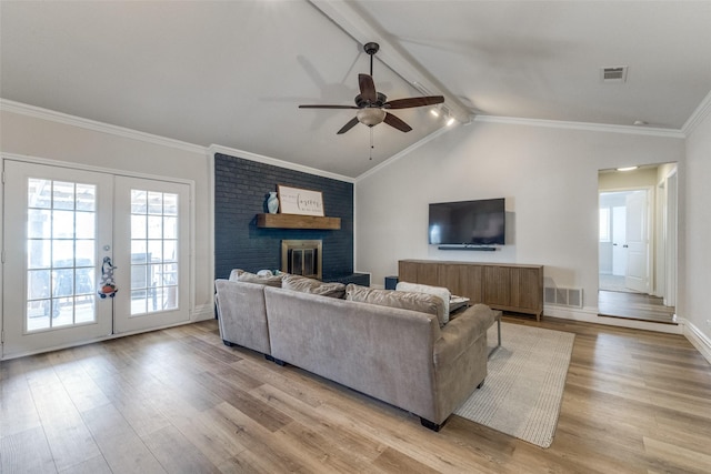 5805 Trail Crest Dr, Arlington, TX 76017 - living area with light wood finished floors, a ceiling fan, healthy amount of natural light, and crown molding