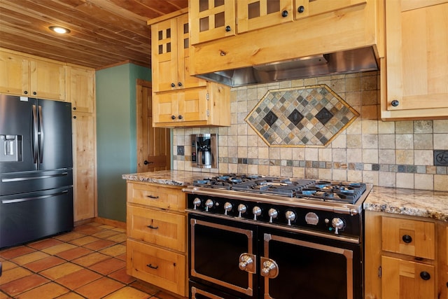 kitchen with tasteful backsplash, light tile patterned floors, extractor fan, appliances with stainless steel finishes, and wooden ceiling
