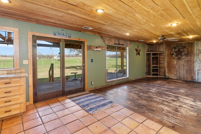 doorway featuring a ceiling fan, visible vents, recessed lighting, wooden ceiling, and wood finished floors