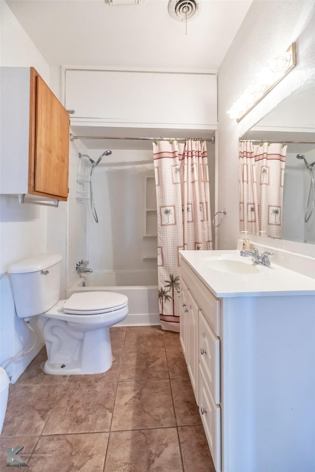bathroom with vanity, visible vents, tile patterned flooring, shower / bath combo with shower curtain, and toilet
