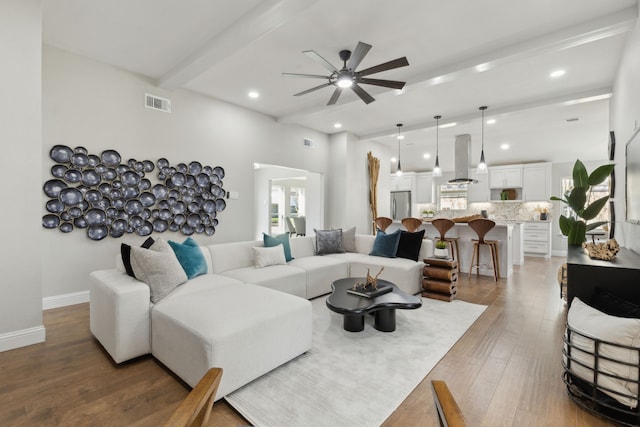 1105 Northpark Dr, Richardson, TX 75081 - living room featuring ceiling fan, light wood-style flooring, recessed lighting, beam ceiling, and baseboards