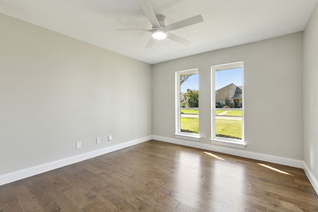 1105 Northpark Dr, Richardson, TX 75081 - unfurnished room with ceiling fan, baseboards, and dark wood-type flooring