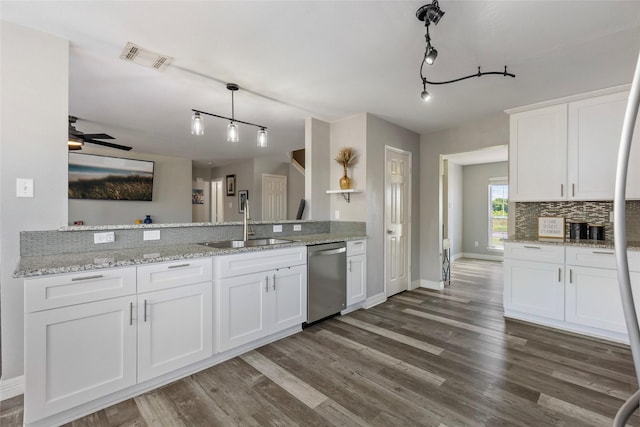 kitchen featuring visible vents, dark wood finished floors, a sink, white cabinets, and dishwasher