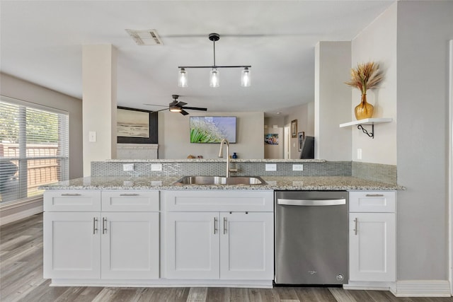 kitchen featuring visible vents, open shelves, stainless steel dishwasher, a ceiling fan, and a sink