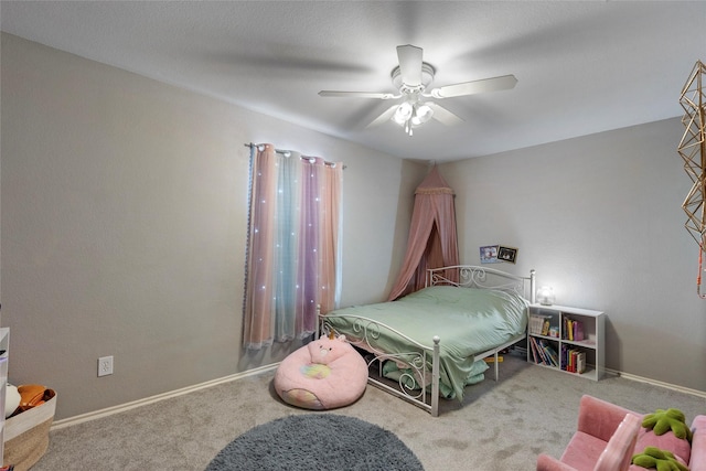 carpeted bedroom with baseboards and ceiling fan