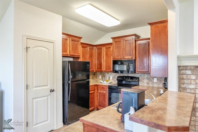 358 Sugarberry Ave, Abilene, TX 79602 - kitchen with a peninsula, brown cabinets, black appliances, and backsplash