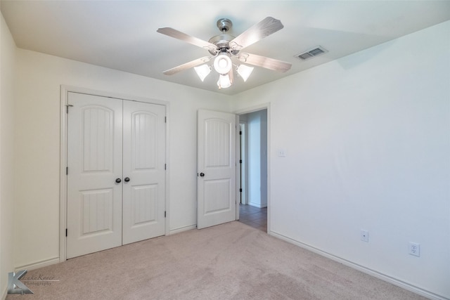 358 Sugarberry Ave, Abilene, TX 79602 - unfurnished bedroom with light colored carpet, a closet, baseboards, and a ceiling fan