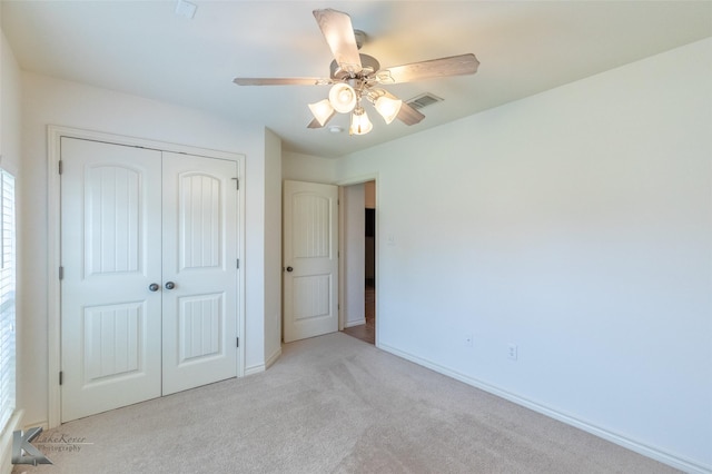358 Sugarberry Ave, Abilene, TX 79602 - unfurnished bedroom with light colored carpet, a closet, baseboards, and a ceiling fan