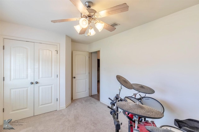 358 Sugarberry Ave, Abilene, TX 79602 - workout area with visible vents, ceiling fan, light colored carpet, and baseboards