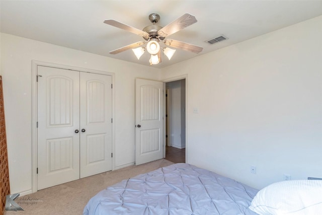 358 Sugarberry Ave, Abilene, TX 79602 - bedroom with visible vents, a closet, light colored carpet, and a ceiling fan