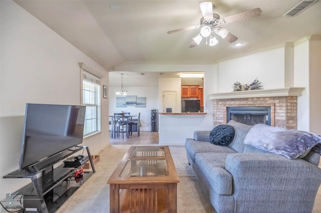 358 Sugarberry Ave, Abilene, TX 79602 - living area with visible vents, a fireplace, vaulted ceiling, ceiling fan with notable chandelier, and light carpet