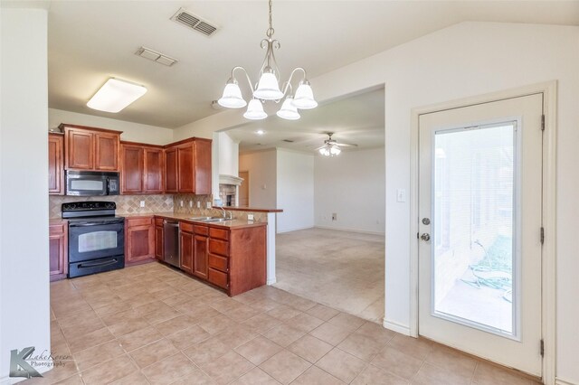 358 Sugarberry Ave, Abilene, TX 79602 - kitchen featuring black appliances, a peninsula, a chandelier, tasteful backsplash, and healthy amount of natural light