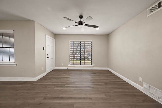 1010 Belew St, Irving, TX 75061 - empty room featuring dark wood-style floors, a ceiling fan, visible vents, and baseboards