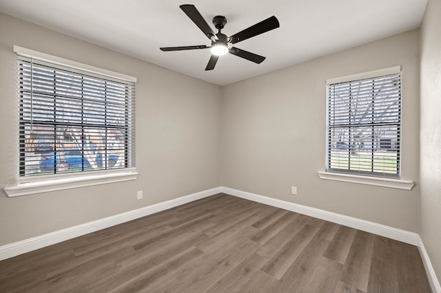 1010 Belew St, Irving, TX 75061 - unfurnished room with a healthy amount of sunlight, ceiling fan, baseboards, and wood finished floors