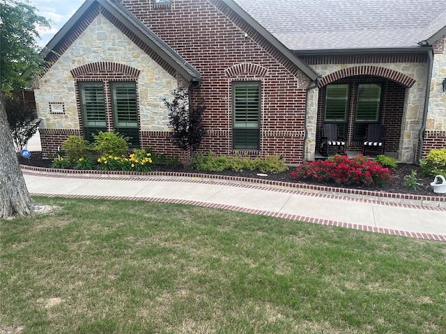 5071 Judy Dr, Midlothian, TX 76065 - view of property exterior featuring a yard, stone siding, brick siding, and a shingled roof