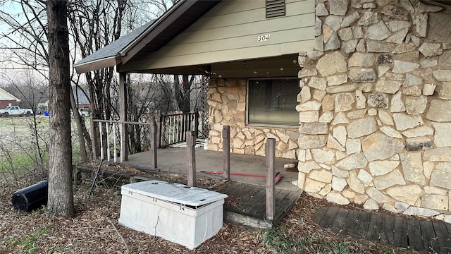 exterior space with stone siding