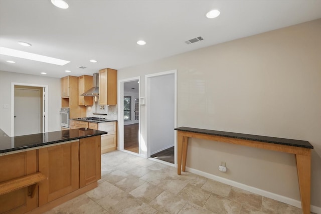 2616 Appledale Ln, Dallas, TX 75287 - kitchen with oven, dark countertops, baseboards, wall chimney range hood, and recessed lighting