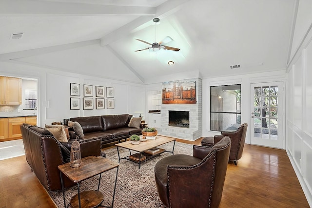 2616 Appledale Ln, Dallas, TX 75287 - living room with a decorative wall, a ceiling fan, wood finished floors, and a fireplace