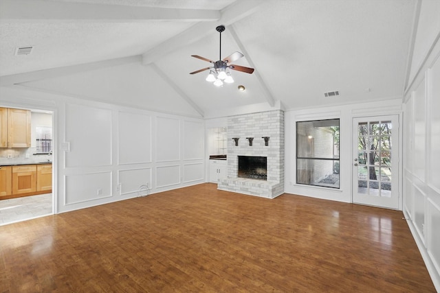 2616 Appledale Ln, Dallas, TX 75287 - unfurnished living room with a decorative wall, ceiling fan, light wood-type flooring, and a fireplace