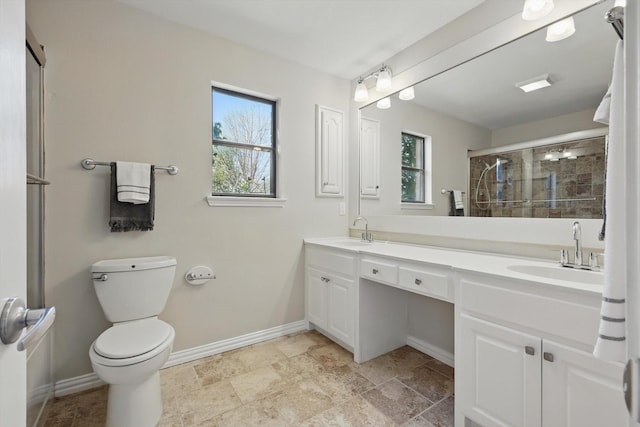 2616 Appledale Ln, Dallas, TX 75287 - bathroom with plenty of natural light, double vanity, baseboards, and a tile shower