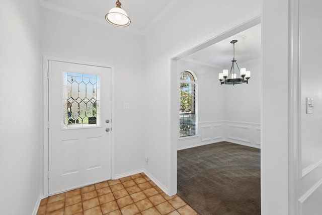 2616 Appledale Ln, Dallas, TX 75287 - foyer entrance with a chandelier and ornamental molding