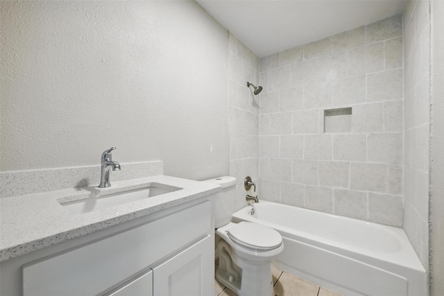 full bath with toilet, vanity, tile patterned floors, and shower / bath combination
