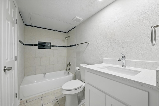 bathroom featuring tile patterned floors, a textured ceiling, shower / bathing tub combination, vanity, and toilet