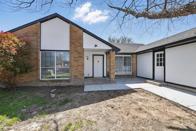 view of front of house with brick siding