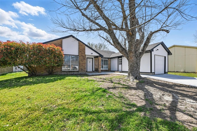 mid-century modern home featuring concrete driveway, a front lawn, brick siding, and a garage