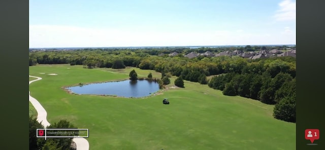 bird's eye view featuring golf course view and a water view