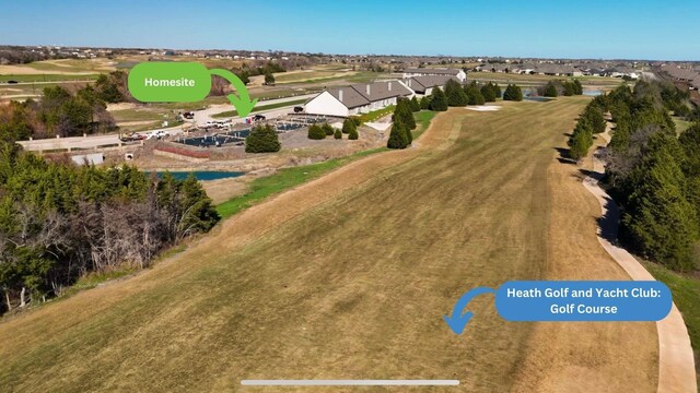 drone / aerial view featuring golf course view