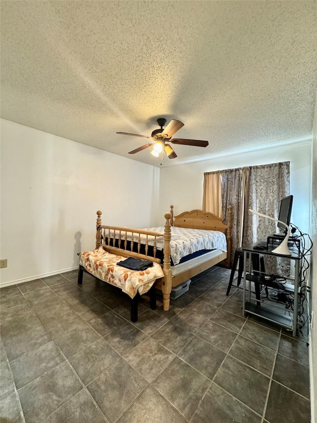 2604 Glenmore Dr, Mesquite, TX 75150 - bedroom featuring baseboards, a textured ceiling, and a ceiling fan