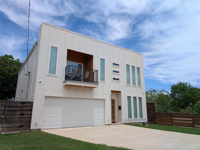 3531 Gallagher St, Dallas, TX 75212 - modern home featuring a balcony, board and batten siding, an attached garage, and concrete driveway