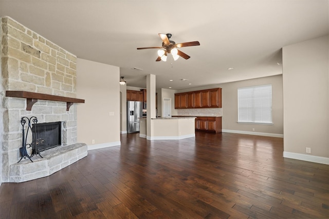 1305 Greenrock Ct, Midlothian, TX 76065 - unfurnished living room with a ceiling fan, a fireplace, dark wood-type flooring, baseboards, and recessed lighting