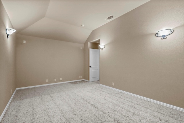 1305 Greenrock Ct, Midlothian, TX 76065 - empty room featuring light colored carpet, lofted ceiling, and baseboards