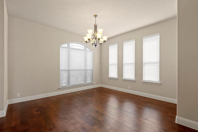 1305 Greenrock Ct, Midlothian, TX 76065 - spare room with a chandelier, dark wood finished floors, and baseboards