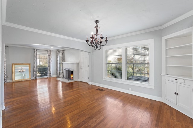2508 Carnation Ave, Fort Worth, TX 76111 - unfurnished living room with a chandelier, a fireplace with flush hearth, wood finished floors, baseboards, and ornamental molding