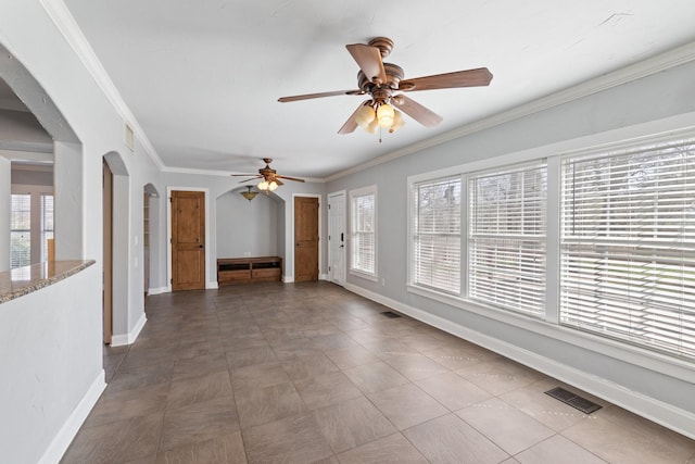2508 Carnation Ave, Fort Worth, TX 76111 - unfurnished living room with arched walkways, a ceiling fan, baseboards, and crown molding