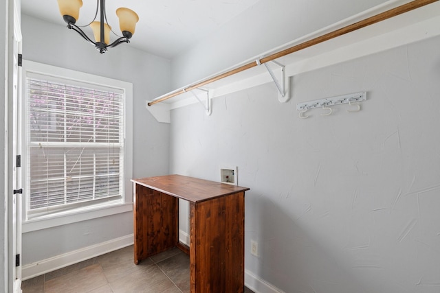 2508 Carnation Ave, Fort Worth, TX 76111 - spacious closet featuring a chandelier and tile patterned flooring