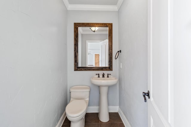 2508 Carnation Ave, Fort Worth, TX 76111 - half bathroom featuring ornamental molding, toilet, tile patterned flooring, and baseboards