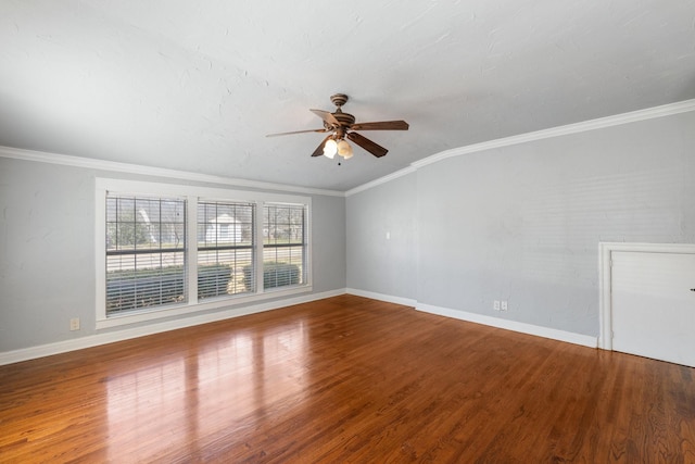 2508 Carnation Ave, Fort Worth, TX 76111 - spare room featuring a ceiling fan, wood finished floors, baseboards, ornamental molding, and vaulted ceiling