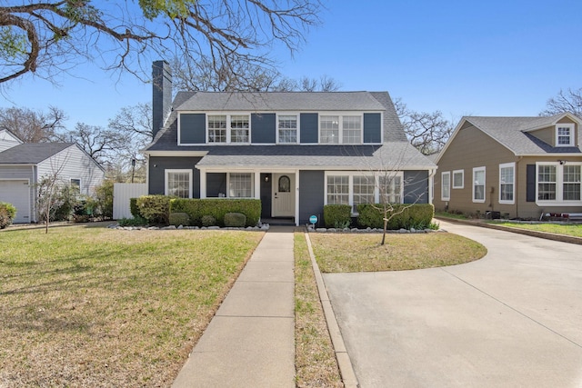 2508 Carnation Ave, Fort Worth, TX 76111 - view of front facade with a chimney, a front lawn, and a shingled roof