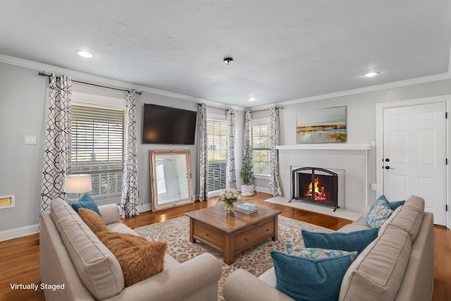 2508 Carnation Ave, Fort Worth, TX 76111 - living room featuring ornamental molding, baseboards, a fireplace with flush hearth, wood finished floors, and recessed lighting
