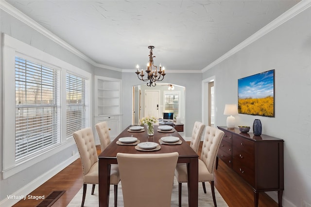 2508 Carnation Ave, Fort Worth, TX 76111 - dining room with a chandelier, crown molding, wood finished floors, built in shelves, and baseboards
