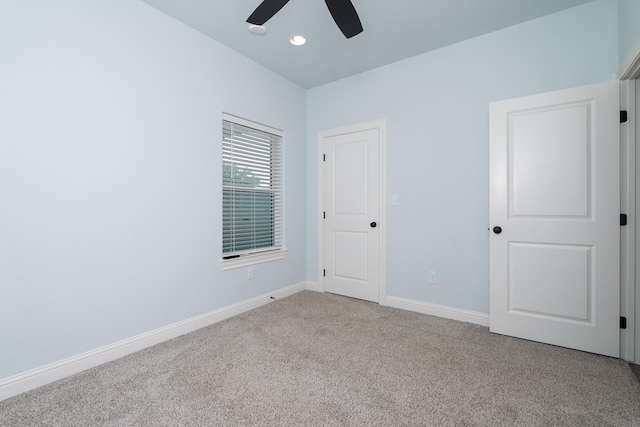 unfurnished bedroom with recessed lighting, a ceiling fan, carpet, and baseboards